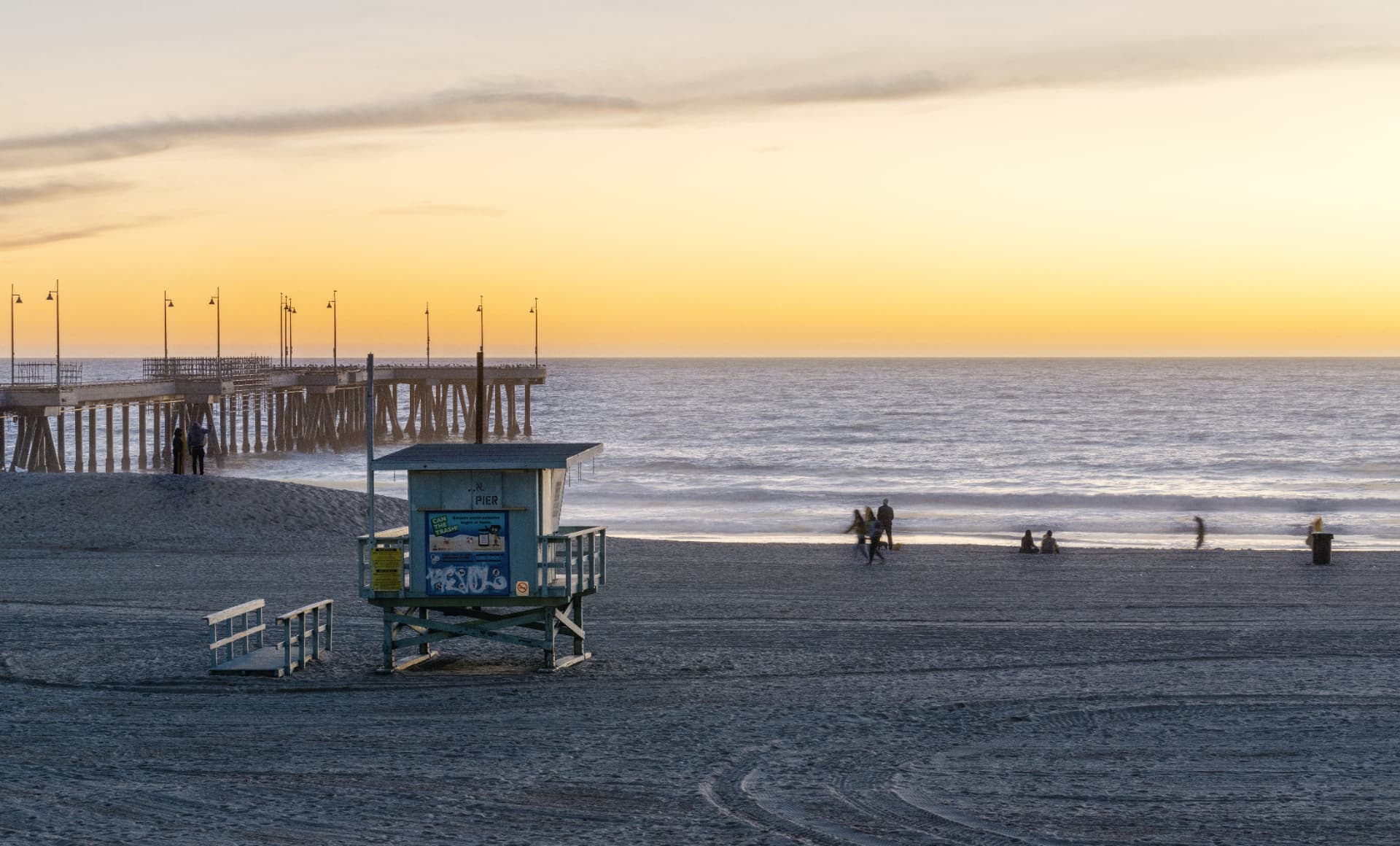 Venice pier and lifeguard tower at sunset
